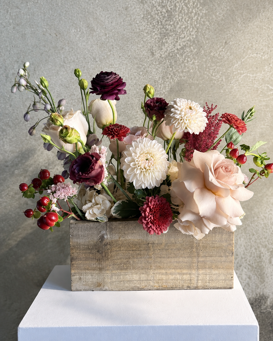 Low blush, ivory and wine floral centrepiece in a wooden box